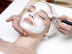 woman receiving customized facial peel treatments